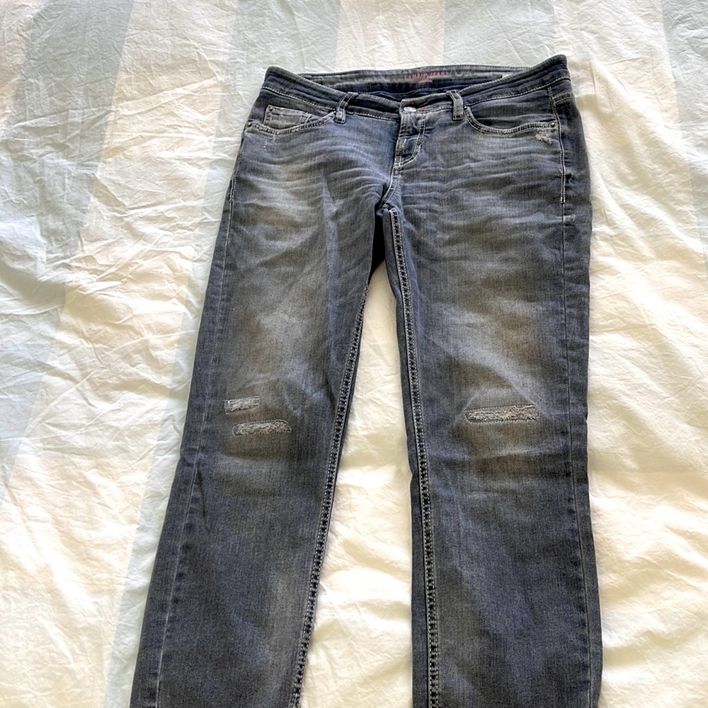 Distressed grey jeans